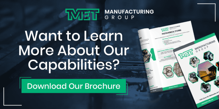 MET Manufacturing Group marketing hero inviting users to download a brochure, with brochures pictured on the right against a dark industrial background.