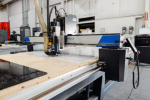 CNC router cutting white tiles