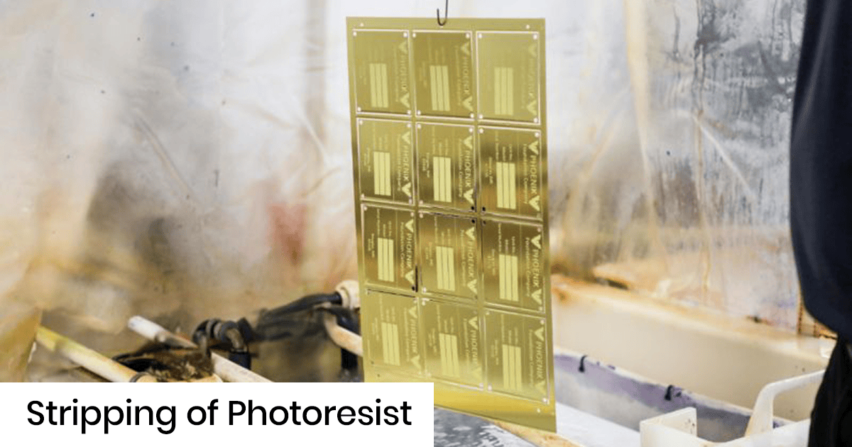 Gold-colored photoresist panels being stripped in a chemical bath during PCB/semiconductor fabrication