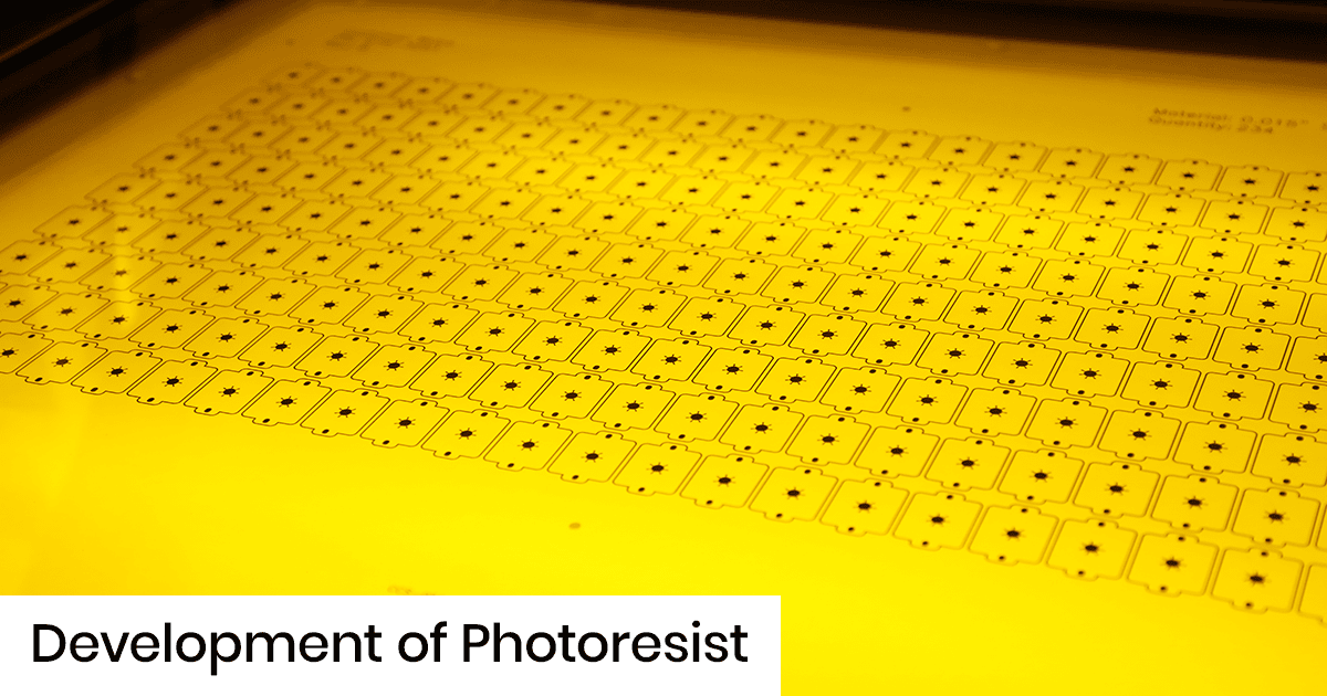 Macro shot of a yellow sheet with repeating square patterns for photoresist development.