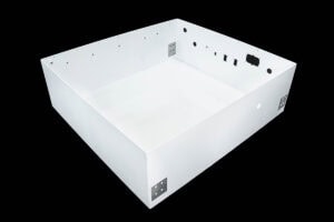 White rectangular metal electronic enclosure with multiple mounting holes, shown against a black background.