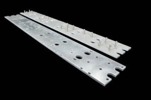 Two silver perforated metal rails with mounting holes and screws on a black background (industrial hardware).