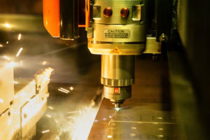 close up of mazak laser cutter in action. sparks flying in background